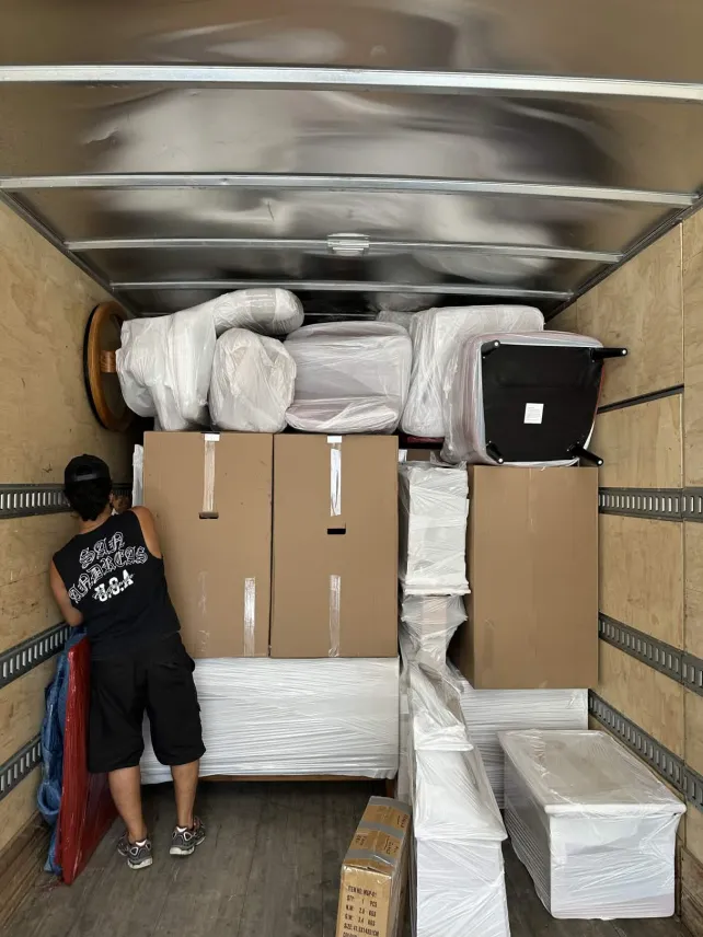 Man sealing box with box tape